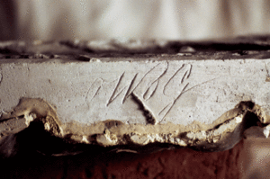 Initials of enslaved plasterer William B. Gould etched into decorative plaster at the Bellamy Mansion in Wilmington.